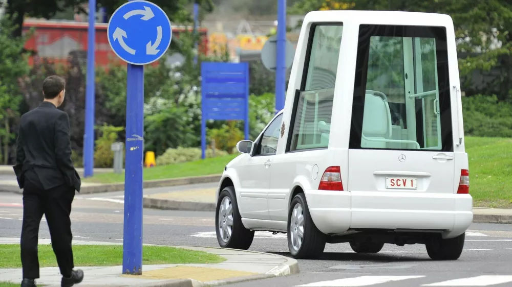 The 'Popemobile' car is driven at a police centre in north London September 14, 2010. Pope Benedict XVI will visit Britain for a four day trip later this week, using the Popemobile on various occasions, and Father Wang expects to meet him in Birmingham on Sunday. REUTERS/Toby Melville (BRITAIN - Tags: RELIGION TRANSPORT)