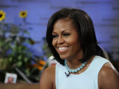 This image released by ABC shows first lady Michelle Obama on the morning program "Good Morning America," Tuesday, May 29, 2012 in New York. Obama discussed a variety of topics including her new book "American Grown: The Story of the White House Kitchen Garden and Gardens Across America," which promotes healthy eating. (AP Photo/ABC, Ida Mae Astute)