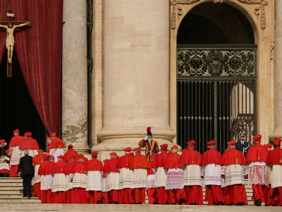 FILE - Cardinals walk through St. Peter's Square ahead of Pope Francis' coffin at the Vatican, Wednesday, April 23, 2025. (AP Photo/Andreea Alexandru, File)
