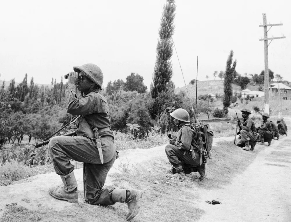 FILE - Indian troops are on the move in Kashmir against guerrilla forces during the second war over Kashmir on Sept. 6, 1965. (AP Photo, File)