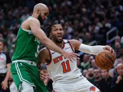 May 7, 2025; Boston, Massachusetts, USA; Boston Celtics guard Derrick White (9) defends against New York Knicks guard Jalen Brunson (11) in the second quarter during game two of the second round for the 2025 NBA Playoffs at TD Garden. Mandatory Credit: David Butler II-Imagn Images