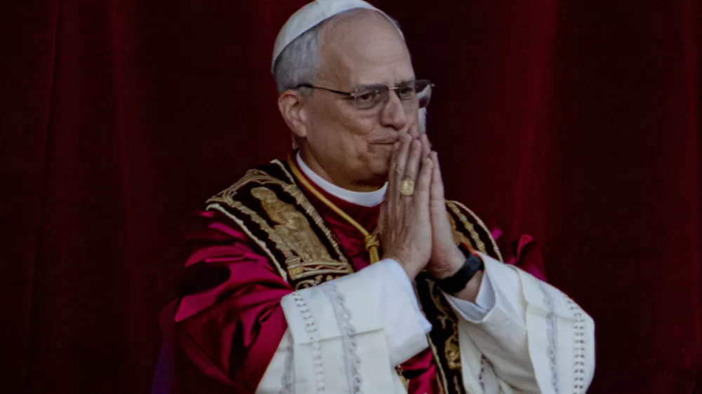 Newly elected Pope Leo XIV, formerly Cardinal Robert Francis Prevost, appears on the central loggia of St. Peter's Basilica at the Vatican shortly after his election as the 267th pontiff of the Roman Catholic Church, Thursday, May 8, 2025. (AP Photo/Domenico Stinellis)