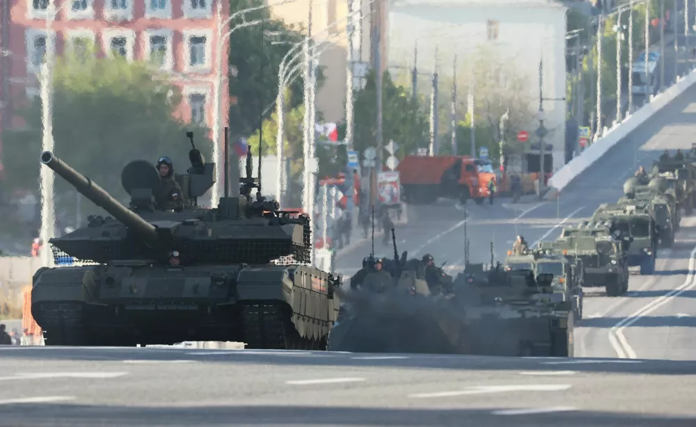 Russian military vehicles drive along a road before a military parade on Victory Day, marking the 80th anniversary of the victory over Nazi Germany in World War Two, in Moscow, Russia, May 9, 2025. REUTERS/Shamil Zhumatov