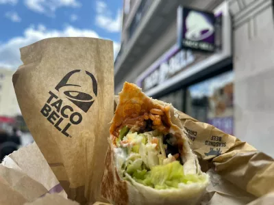 15 May 2024, Great Britain, London: The Taco Bell logo and a burrito can be seen outside a branch of the chain in London. The US fast food chain Taco Bell is expanding into the German market. The first restaurant will open in Berlin this summer, with more to follow. Photo: Julia Kilian/dpa,Image: 873190726, License: Rights-managed, Restrictions: GERMANY OUT, Model Release: no