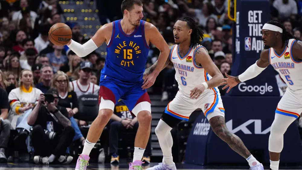 May 9, 2025; Denver, Colorado, USA; Oklahoma City Thunder forward Jaylin Williams (6) defends on Denver Nuggets center Nikola Jokic (15) in the first half during game three of the second round for the 2025 NBA Playoffs at Ball Arena. Mandatory Credit: Ron Chenoy-Imagn Images