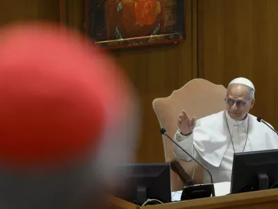 Pope Leo XIV meets the College of Cardinals in the New Synod Hall at the Vatican, Saturday, May 10, 2025. (Vatican Media via AP)