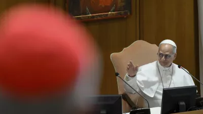 Pope Leo XIV meets the College of Cardinals in the New Synod Hall at the Vatican, Saturday, May 10, 2025. (Vatican Media via AP)