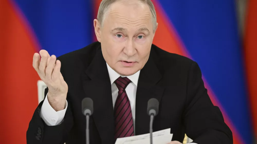 Russian President Vladimir Putin gestures as he speaks to journalists in the Grand Palace at the Kremlin in Moscow, Russia, Sunday, May 11, 2025, after celebrations of the 80th anniversary of the Soviet Union's victory over Nazi Germany during World War II. (Sergei Bobylev/Photo host agency RIA Novosti via AP)