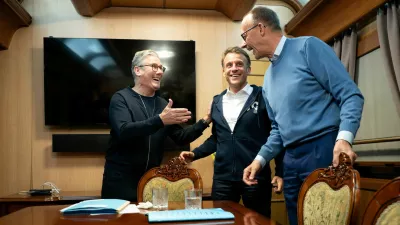 Britain's Prime Minister Keir Starmer meets with French President Emmanuel Macron and German Chancellor Friedrich Merz on board a train to the Ukrainian capital Kyiv where all three will hold meetings with Ukrainian President Volodymyr Zelensky, May 9, 2025. Stefan Rousseau/Pool via REUTERS