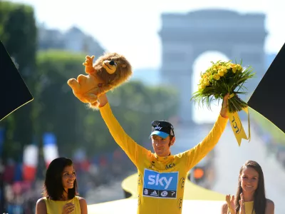 Bradley Wiggins, winner of the 2012 Tour de France cycling race on the podium of the the Tour de France cycling race in Paris, France, Sunday July 22, 2012. (AP Photo/Jerome Prevost, Pool)
