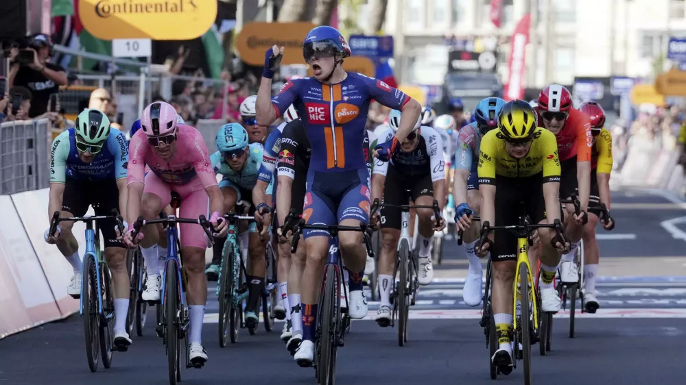 Netherlands' Casper van Uden celebrates as he crosses the finish line to win the fourth stage of the Giro d'Italia cycling race, from Alberobello to Lecce, southern Italy, Tuesday, May 13, 2025. (Gian Mattia D'Alberto/LaPresse via AP)