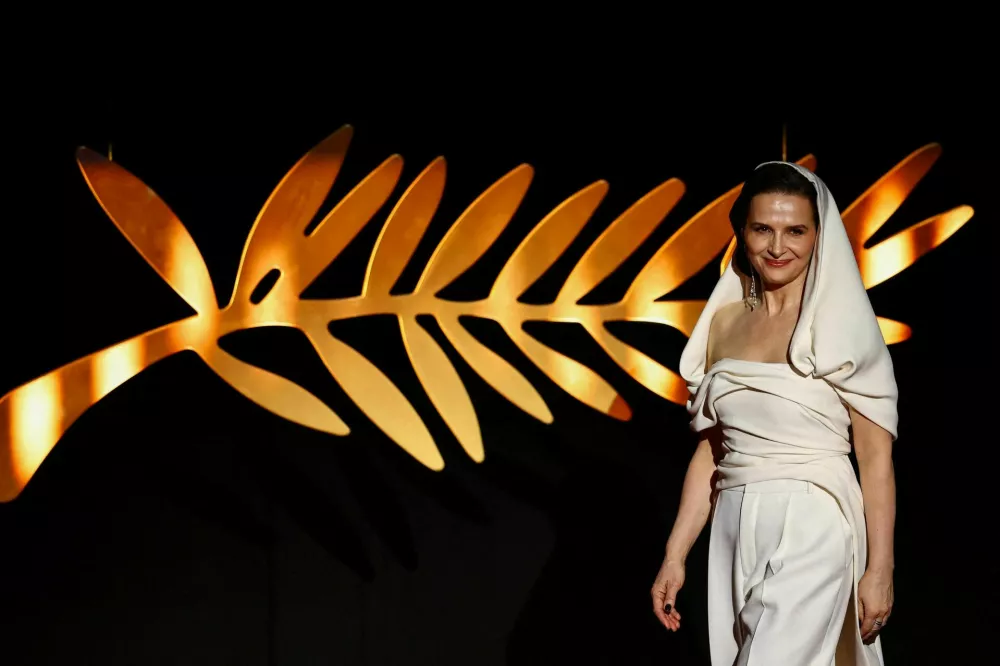 Juliette Binoche, Jury President of the 78th Cannes Film Festival arrives on stage during the opening ceremony and the screening the film "Partir un jour" (Leave One Day) Out of competition at the 78th Cannes Film Festival in Cannes, France, May 13, 2025. REUTERS/Sarah Meyssonnier  TPX IMAGES OF THE DAY