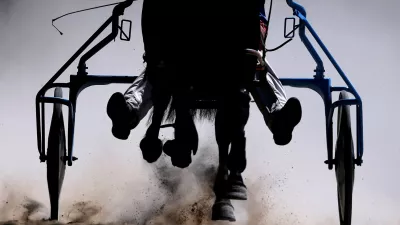 A jockey competes during Harness Racing in York, Britain, May 10, 2025. REUTERS/Lee Smith  TPX IMAGES OF THE DAY