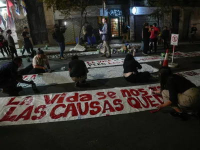 People paint banners outside the Movimiento de Participacion Popular (MPP) party headquarters, following the death of Uruguay's former President Jose "Pepe" Mujica at the age of 89, in Montevideo, Uruguay May 13, 2025. REUTERS/Andres Cuenca