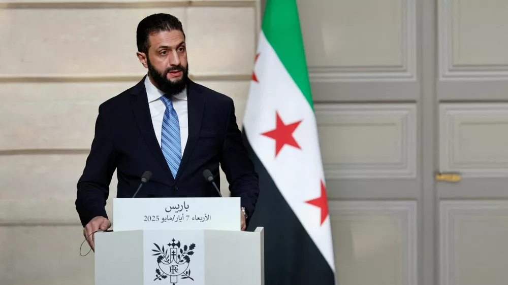 FILE PHOTO: Syrian President Ahmed al-Sharaa speaks during a joint press conference with French President Emmanuel Macron after a meeting at the Elysee Palace in Paris, France, May 7, 2025. REUTERS/Stephanie Lecocq/Pool/File Photo