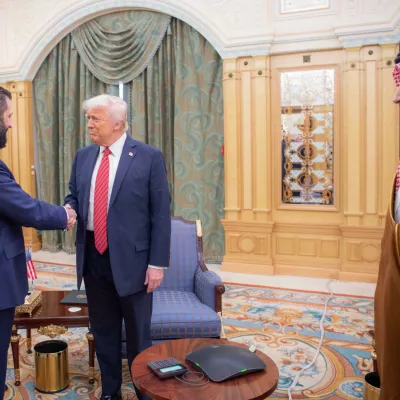 14 May 2025, Saudi Arabia, Riyadh: Saudi Crown Prince Mohammed bin Salman (R) looks on as US President Donald Trump (C) shakes hands with Syria's interim President Ahmad al-Sharaa (L) in Riyadh. Photo: -/Saudi Press Agency/dpa
