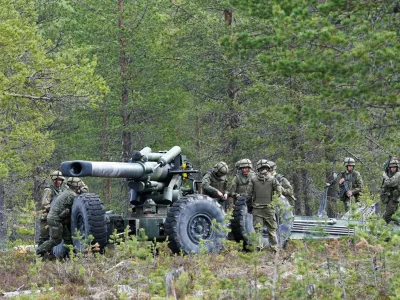 FILE PHOTO: Troops operate a 155K gun during the Northern Forest land force exercise in Rovajarvi, Finland May 30, 2023. REUTERS/Janis Laizans/File Photo