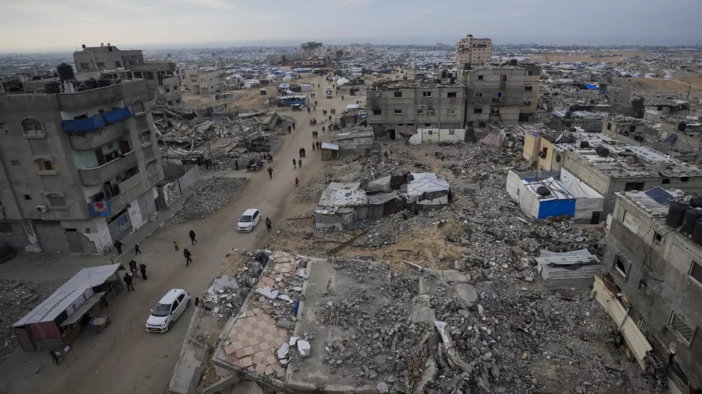 FILE - A tent camp for displaced Palestinians is set up amid destroyed buildings in the Khan Younis refugee camp, southern Gaza Strip, Jan. 4, 2025. (AP Photo/Abdel Kareem Hana, File)