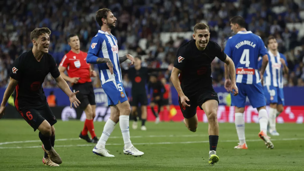 Barcelona's Fermin Lopez, right, celebrates with his teammate Barcelona's Gavi after scoring his side's second goal during a Spanish La Liga soccer match between Barcelona and Espanyol at Lluis Companys Olympic Stadium in Barcelona, Spain, Thursday, May 15, 2025. (AP Photo/Joan Monfort)