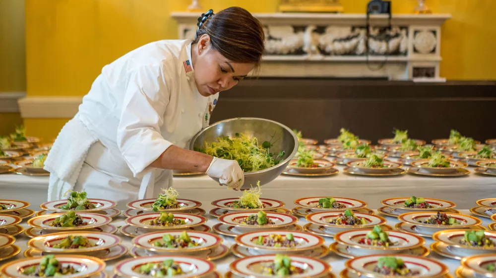 White House Executive Chef Cris Comerford prepares dishes of Quinoa Black Bean and Corn Salad for the Epicurious Kids? State Dinner in the Old Family Dining Room of the White House, Aug. 20, 2012. (Official White House Photo by Sonya N. Hebert)This official White House photograph is being made available only for publication by news organizations and/or for personal use printing by the subject(s) of the photograph. The photograph may not be manipulated in any way and may not be used in commercial or political materials, advertisements, emails, products, promotions that in any way suggests approval or endorsement of the President, the First Family, or the White House.