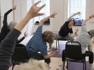 Whitney Chapman, right, conducts a chair yoga class at the Marlene Meyerson JCC Manhattan, in New York, March 28, 2025. (AP Photo/Richard Drew)