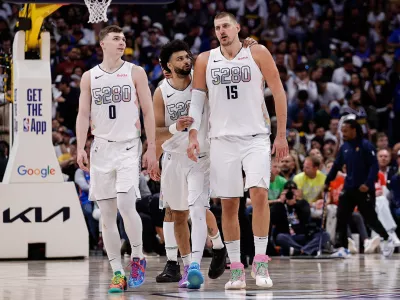 May 15, 2025; Denver, Colorado, USA; Denver Nuggets guard Jamal Murray (27) and center Nikola Jokic (15) and guard Christian Braun (0) in the fourth quarter against the Oklahoma City Thunder during game six of the second round for the 2025 NBA Playoffs at Ball Arena. Mandatory Credit: Isaiah J. Downing-Imagn Images