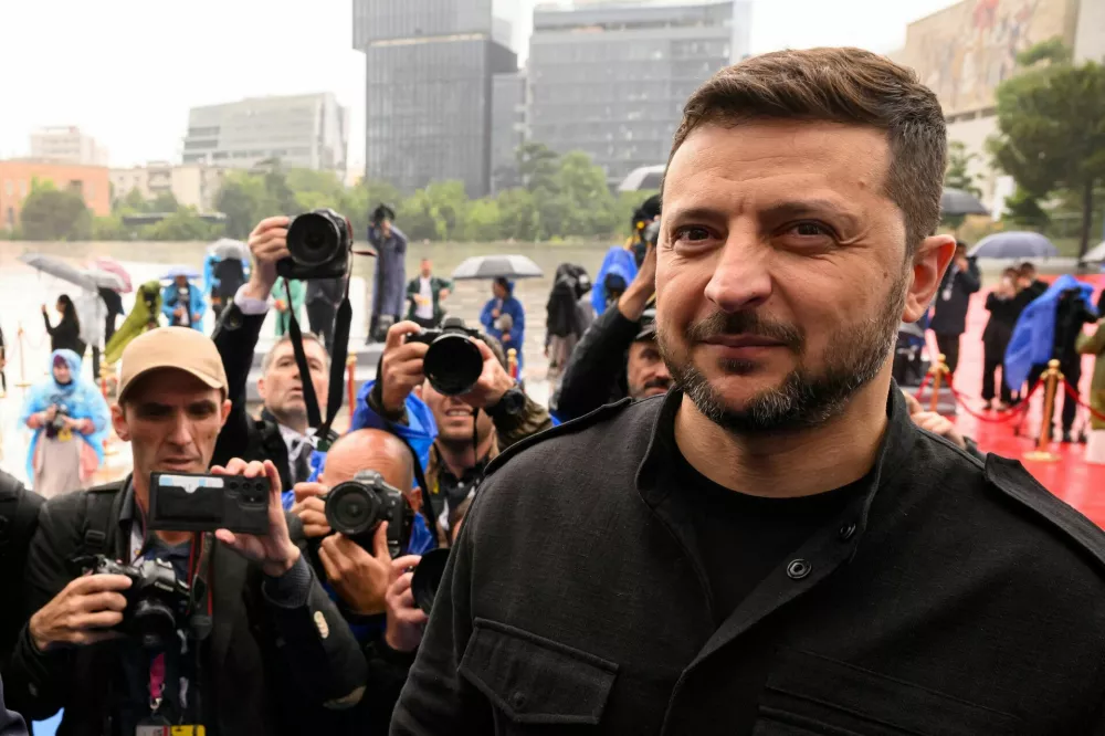 TIRANA, ALBANIA - MAY 16: Ukraine's President Volodymyr Zelenskiy is followed by members of the media at the 6th European Political Community summit on May 16, 2025 in Tirana, Albania. Leon Neal/Pool via REUTERS