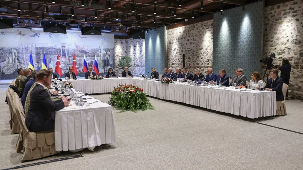 In this handout photo released by Turkish Foreign Ministry, Turkish Foreign Minister Hakan Fidan, center, chairs a meeting between delegations from Russia, right, and Ukraine, left, at Dolmabahce palace in Istanbul, Turkey, Friday, May 16, 2025. (Murat Gok/Turkish Foreign Ministry via AP)