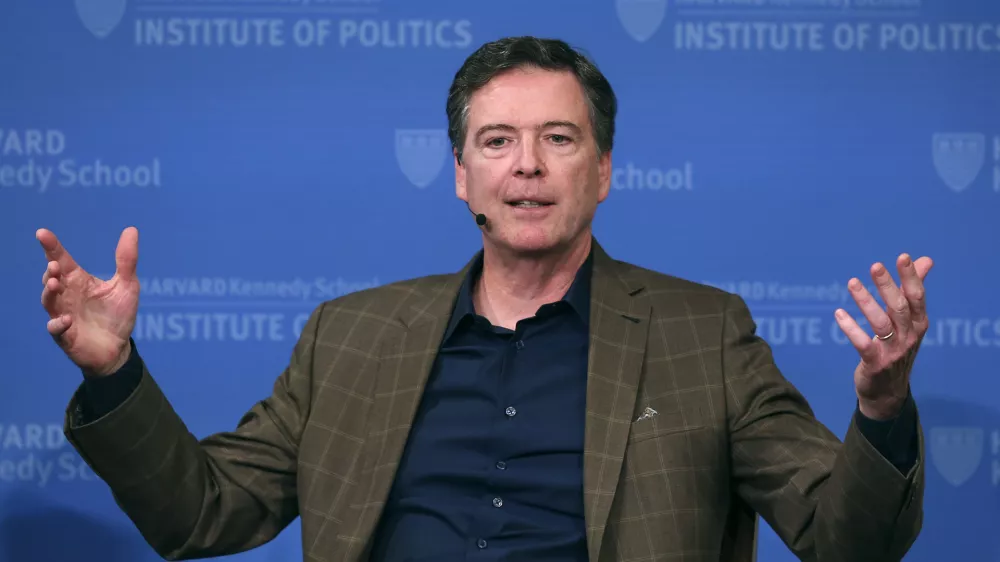 FILE - Former FBI director James Comey gestures while speaking at Harvard University's Institute of Politics' JFK Jr. Forum in Cambridge, Mass., Feb. 24, 2020. (AP Photo/Charles Krupa, File)