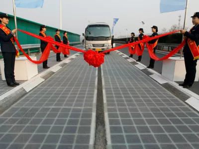 A vehicle is seen on a solar panel expressway during its opening in Jinan, Shandong province, China December 28, 2017. Picture taken December 28, 2017. REUTERS/Stringer ATTENTION EDITORS - THIS IMAGE WAS PROVIDED BY A THIRD PARTY. CHINA OUT.