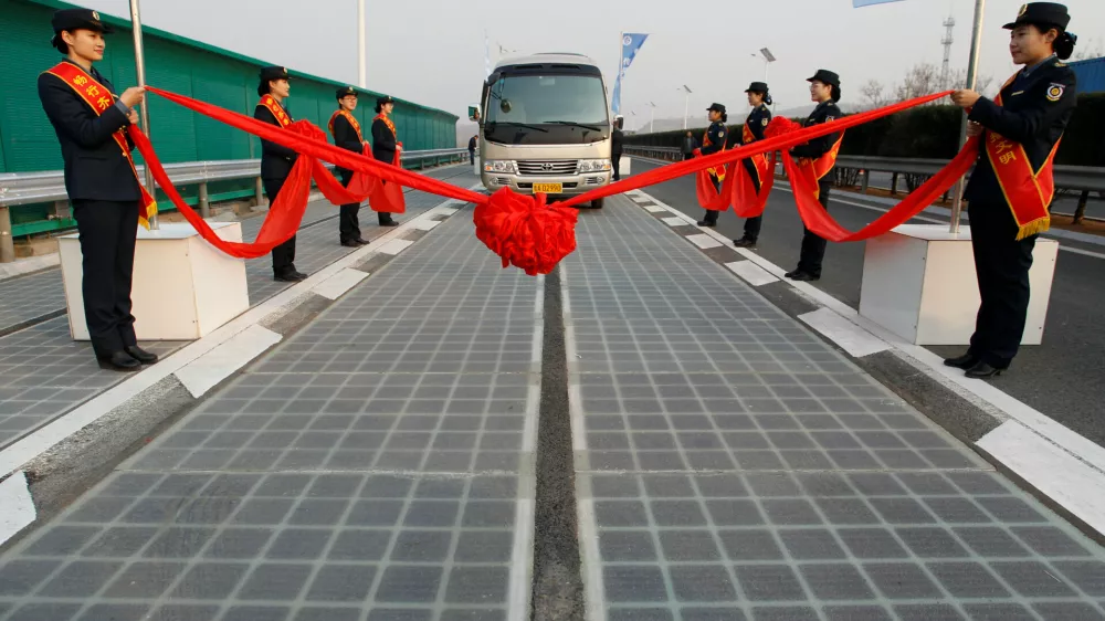 A vehicle is seen on a solar panel expressway during its opening in Jinan, Shandong province, China December 28, 2017. Picture taken December 28, 2017. REUTERS/Stringer ATTENTION EDITORS - THIS IMAGE WAS PROVIDED BY A THIRD PARTY. CHINA OUT.