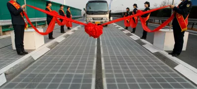 A vehicle is seen on a solar panel expressway during its opening in Jinan, Shandong province, China December 28, 2017. Picture taken December 28, 2017. REUTERS/Stringer ATTENTION EDITORS - THIS IMAGE WAS PROVIDED BY A THIRD PARTY. CHINA OUT.