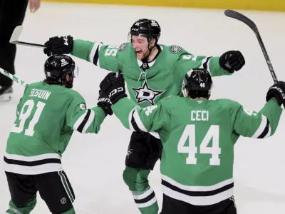 Dallas Stars' Tyler Seguin (91), Thomas Harley (55) and Cody Ceci (44) celebrate after Harley scored in overtime in Game 6 of a second-round NHL hockey playoff series against the Winnipeg Jets in Dallas, Saturday, May 17, 2025. (AP Photo/Gareth Patterson)