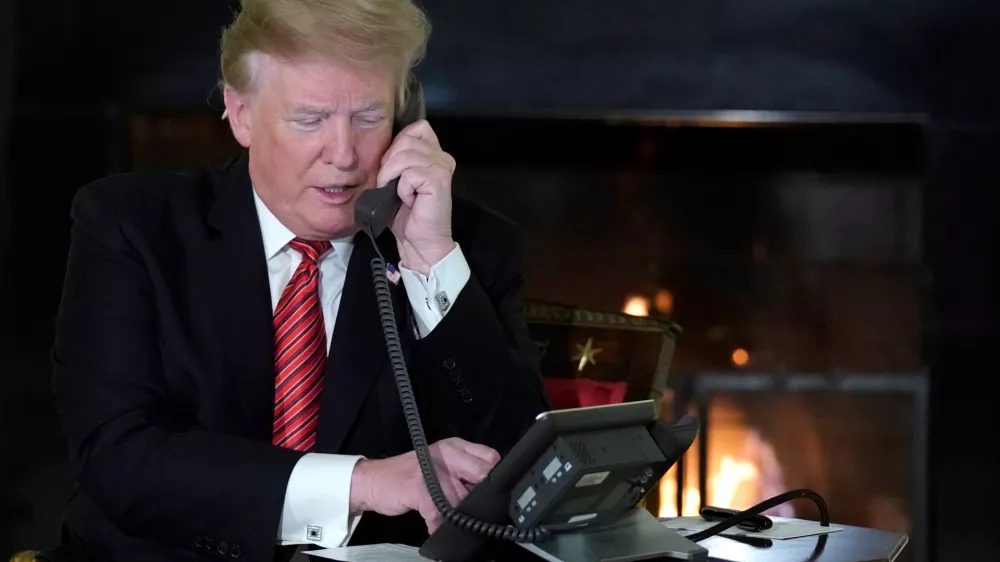 U.S. President Donald Trump participates in NORAD Santa tracker phone calls from the White House in Washington, U.S. December 24, 2018. REUTERS/Jonathan Ernst - RC16541E9E50
