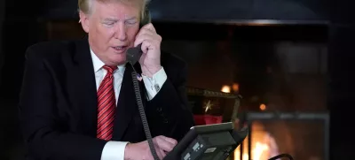 U.S. President Donald Trump participates in NORAD Santa tracker phone calls from the White House in Washington, U.S. December 24, 2018. REUTERS/Jonathan Ernst - RC16541E9E50