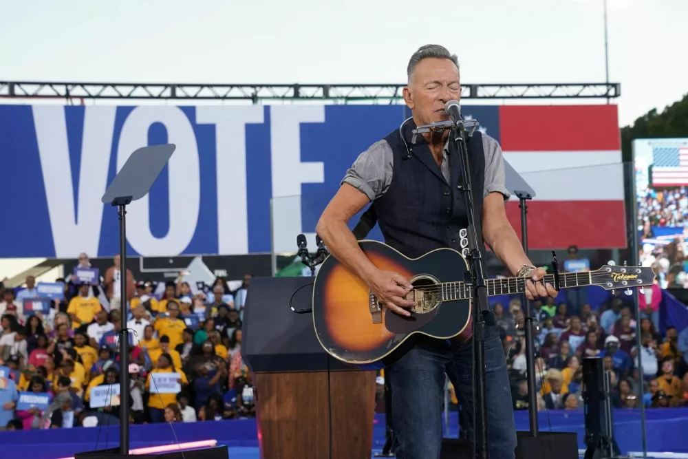 Bruce Springsteen performs during a rally for Democratic presidential nominee U.S. Vice President Kamala Harris in Atlanta, Georgia, U.S., October 24, 2024. REUTERS/Kevin Lamarque