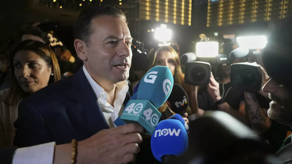 Incumbent Prime Minister and leader of the center-right Social Democratic Party Luis Montenegro arrives at the party's headquarters following Portugal's general election, in Lisbon, Sunday, May 18, 2025. (AP Photo/Armando Franca)
