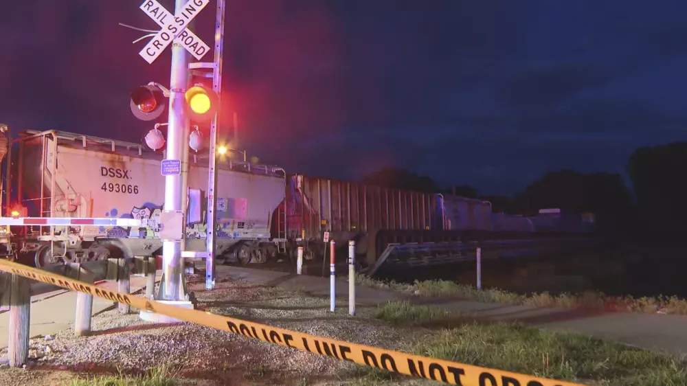 In this image made from video, a train sits idle on tracks after striking multiple pedestrians Sunday evening, May 18, 2025, in Fremont, Ohio. (WTVG/13 Action News via AP)