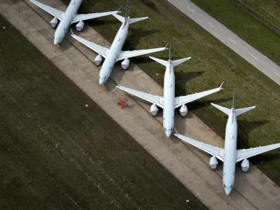American Airlines 737 max passenger planes are parked on the tarmac at Tulsa International Airport in Tulsa, Oklahoma, U.S. March 23, 2020. REUTERS/Nick Oxford REFILE - CORRECTING PLANE MODEL AND SLUG, REMOVING REFERENCE TO CORONAVIRUS