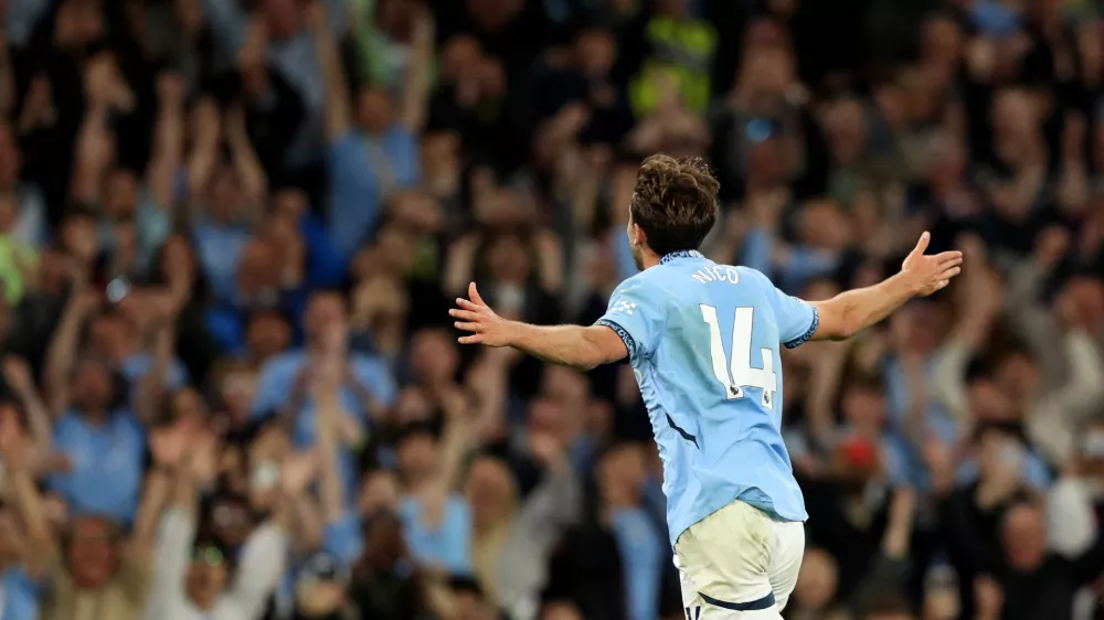 Soccer Football - Premier League - Manchester City v AFC Bournemouth - Etihad Stadium, Manchester, Britain - May 20, 2025 Manchester City's Nicolas Gonzalez celebrates scoring their third goal REUTERS/Scott Heppell EDITORIAL USE ONLY. NO USE WITH UNAUTHORIZED AUDIO, VIDEO, DATA, FIXTURE LISTS, CLUB/LEAGUE LOGOS OR 'LIVE' SERVICES. ONLINE IN-MATCH USE LIMITED TO 120 IMAGES, NO VIDEO EMULATION. NO USE IN BETTING, GAMES OR SINGLE CLUB/LEAGUE/PLAYER PUBLICATIONS. PLEASE CONTACT YOUR ACCOUNT REPRESENTATIVE FOR FURTHER DETAILS..