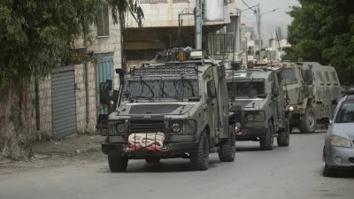 08 April 2025, Palestinian Territories, Nablus: Israeli army armoured vehicles moves along a road during a military operation in Nablus in the occupied West Bank. Photo: Mohammed Nasser/APA Images via ZUMA Press Wire/dpa