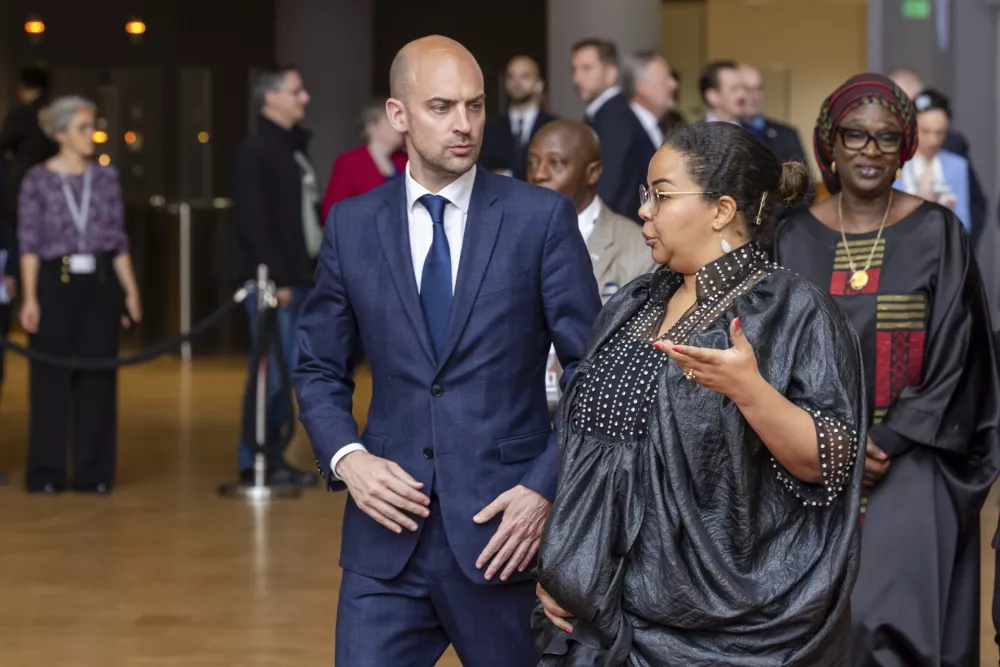 French Foreign Minister Jean-Noel Barrot, center, speaks with Democratic Republic of Congo Foreign Minister Th&eacute;r&egrave;se Kayikwamba Wagner during a group photo at the European Union-African Union ministerial meeting in Brussels, Wednesday, May 21, 2025. (AP Photo/Geert Vanden Wijngaert)