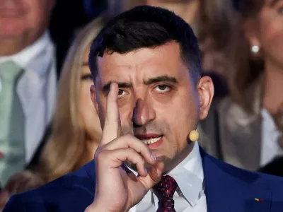 Presidential candidate George Simion reacts to exit polls of Romania's second round of the presidential election, in front of the parliament in Bucharest, Romania, May 18, 2025. REUTERS/Louisa Gouliamaki