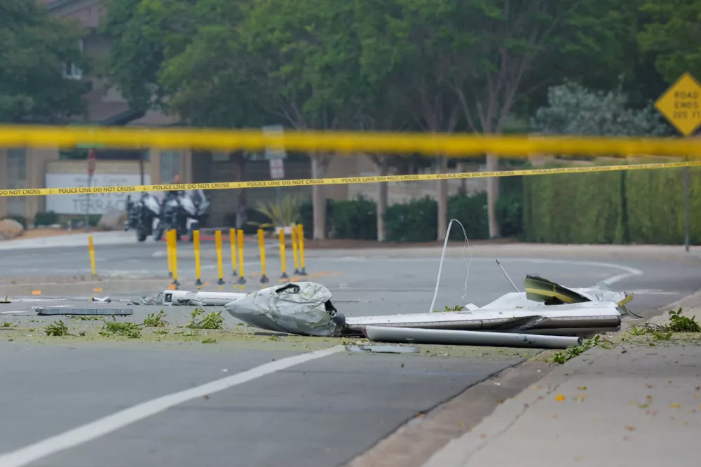 A view shows parts of a small civilian aircraft that went down in a military neighborhood in San Diego, California, U.S. May 22, 2025. REUTERS/Mike Blake