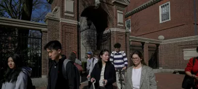 Students walk on the campus of Harvard University in Cambridge, Massachusetts, U.S., April 15, 2025.  REUTERS/Faith Ninivaggi