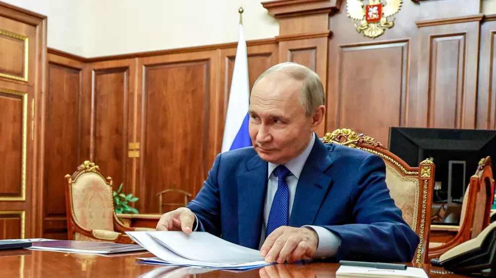 Russian President Vladimir Putin speaks to Rusnano Group CEO Sergei Kulikov during their meeting at the Kremlin in Moscow, Russia, Wednesday, May 21, 2025. (Alexander Kazakov, Sputnik, Kremlin Pool Photo via AP)
