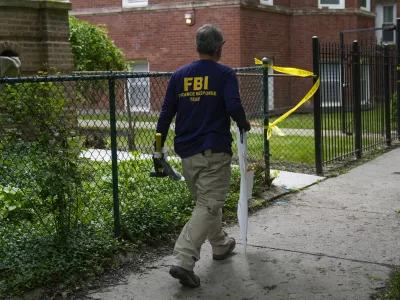 An official works at the scene of an address listed as the home of Elias Rodriguez, who police identified as the suspect in the killing of 2 staff members of the Israeli Embassy in Washington, Thursday, May 22, 2025, in Chicago. (AP Photo/Erin Hooley)
