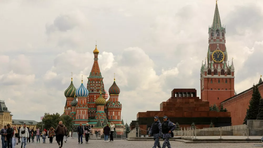 FILE PHOTO: People walk across Red Square near St. Basil's Cathedral and the Kremlin's Spasskaya Tower in central Moscow, Russia September 21, 2022. REUTERS/Evgenia Novozhenina/File Photo