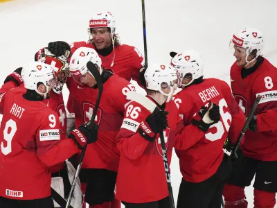 Swiss players celebrate after the semifinal match between Denmark and Switzerland at the ice hockey world championships in Stockholm,Sweden, Saturday, May 24, 2025. (AP Photo/Petr David Josek)