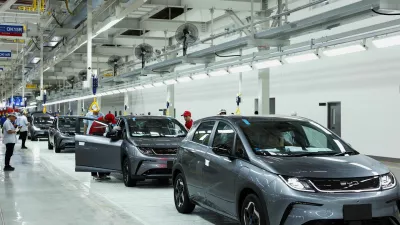 FILE PHOTO: Workers check the EV cars inside BYD's first electric vehicle (EV) factory in Southeast Asia, a fast-growing regional EV market where it has become the dominant player, in Rayong, Thailand, July 4, 2024. REUTERS/Chalinee Thirasupa/File Photo